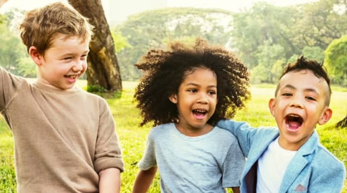 three children having fun outdoors